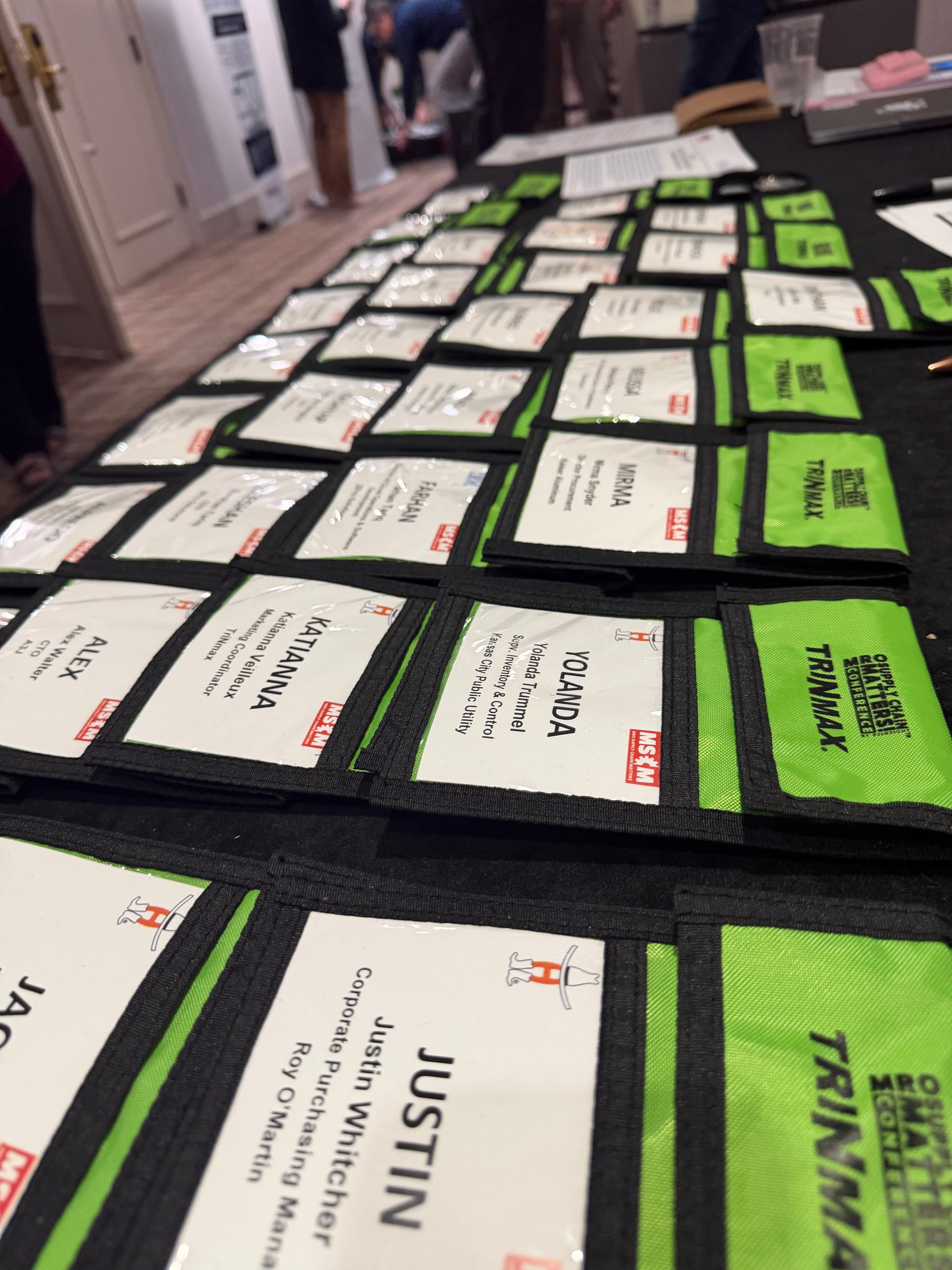 MSCM conference attendees with name badges networking at round tables