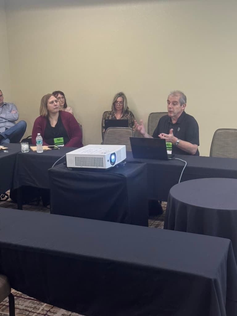 Facilitator leading a small-group MSCM roundtable session
