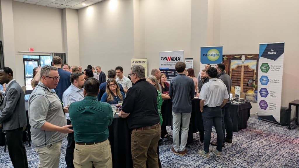 MSCM attendees networking near conference partner displays